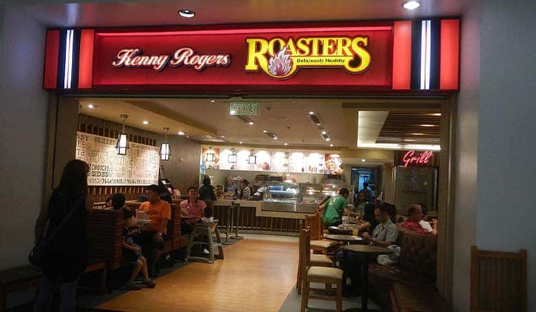 Tourists enjoy dinner at Kenny Rogers Roasters in Manila, Philippines.