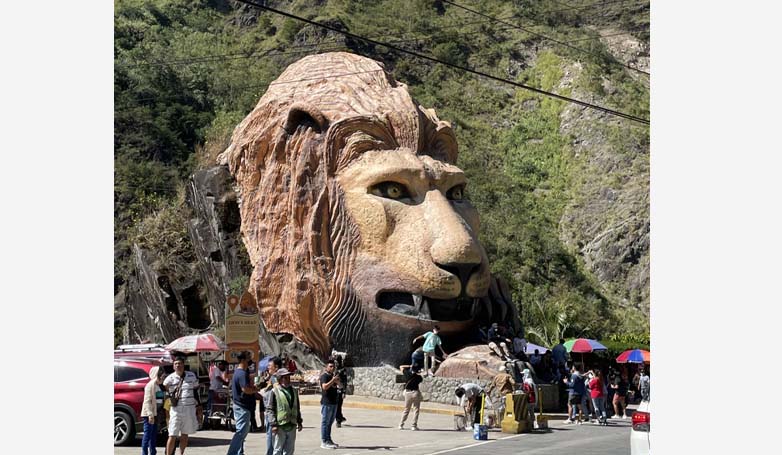 Tourists enjoy taking a picture with iconic Lion’s Head in Baguio City